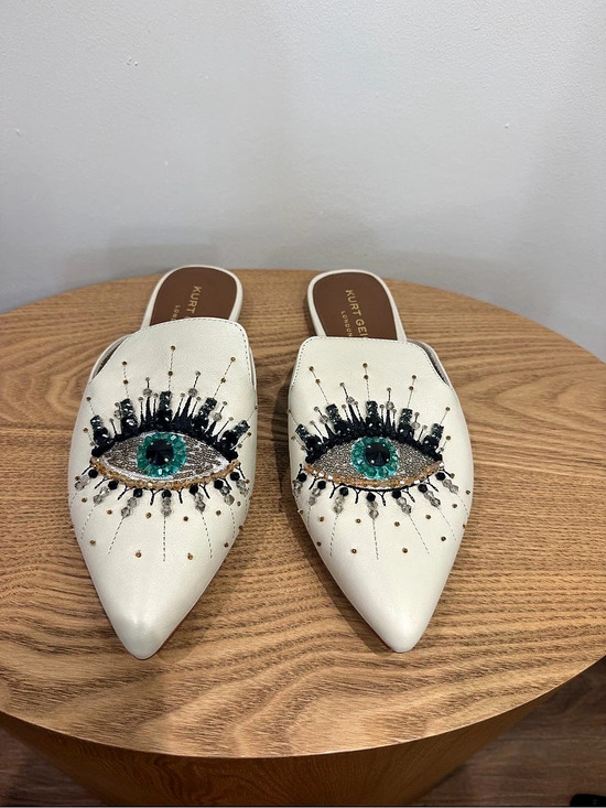 Kurt Geiger Shoes - Kurt Geiger White Leather
Pointed Mules with Green Eye Embellishment